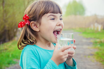 Young woman holding drink