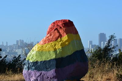 Panoramic view of multi colored buildings against clear sky