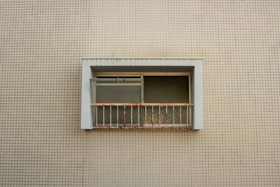 Full frame shot of window on wall of building