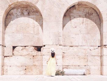 Sculpture in front of built structure
