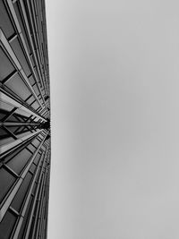 Low angle view of skyscraper against clear sky