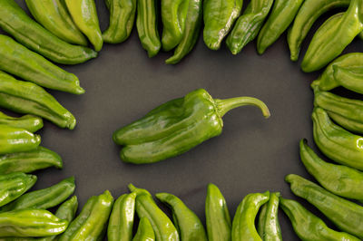 High angle view of green chili peppers