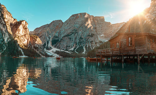 Lake by mountains against sky