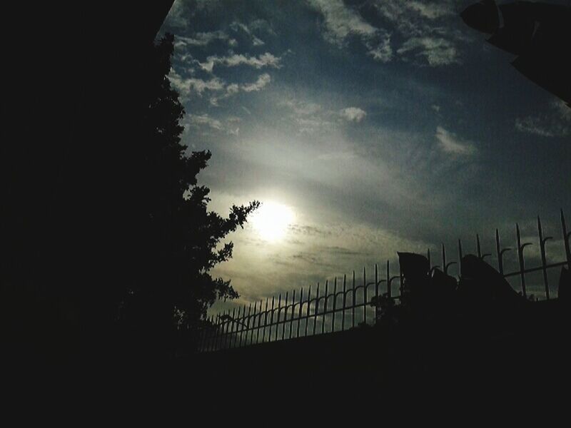 silhouette, sky, built structure, architecture, cloud - sky, building exterior, low angle view, sunset, cloudy, weather, cloud, tree, dusk, nature, no people, dark, connection, outdoors, building, city