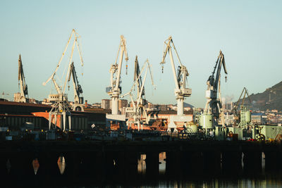 Boats moored at harbor