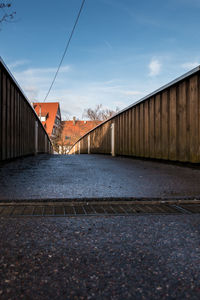 Surface level of bridge over road along buildings