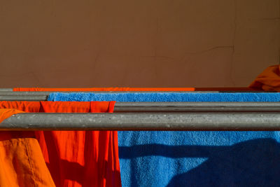 Orange buddhist monks clothing hanging down in the pagoda