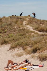 People lying on land