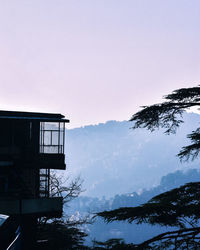 Scenic view of mountains against clear sky during winter