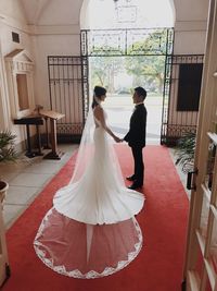Rear view of woman with umbrella