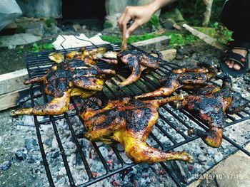 High angle view of meat on barbecue grill