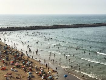 High angle view of people on beach against sky