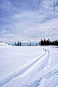 Scenic view of snow field against sky