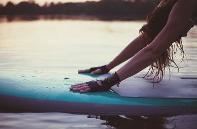 Woman on paddleboard in sea