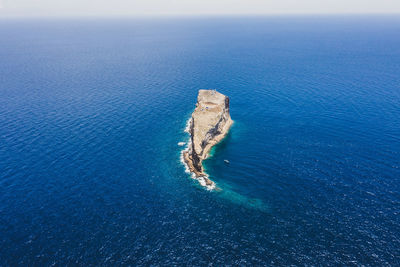 High angle view of sea shore against sky