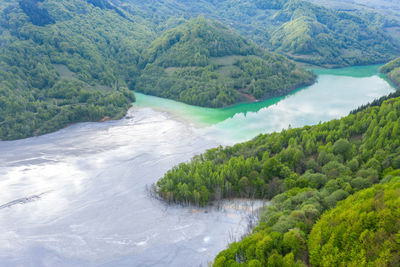 Aerial view of a decanting lake,  rosia poieni copper pit flooding the village of geamana, romania