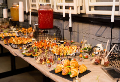 Buffet table with snacks and drinks at the event in the loft