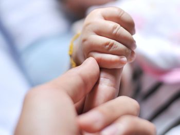 Close-up of woman holding hands