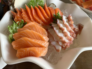 Close-up of fish served in plate on table