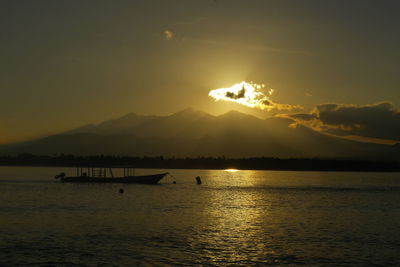 Scenic view of river at sunset