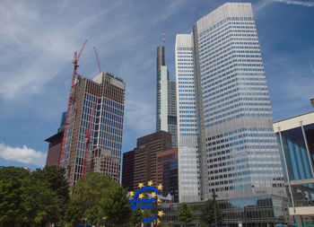 Low angle view of buildings against sky in city