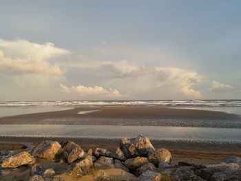 Scenic view of beach against sky