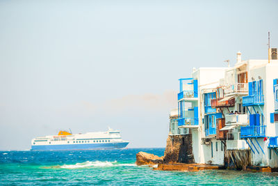 Ship in sea against clear sky