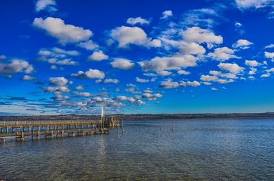 Scenic view of sea against blue sky