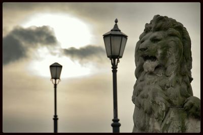 Low angle view of street light against sky