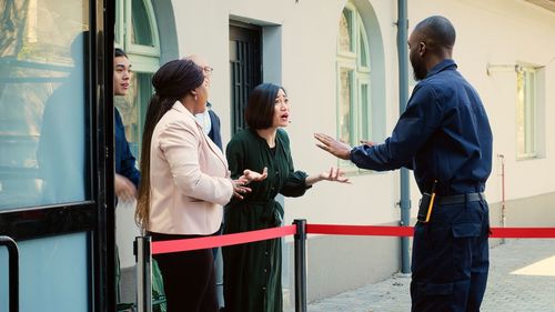 Low angle view of business colleagues working at airport