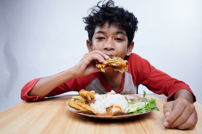 Portrait of woman eating food