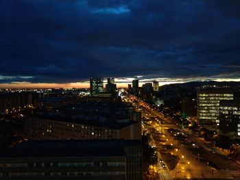 High angle view of illuminated city buildings at night