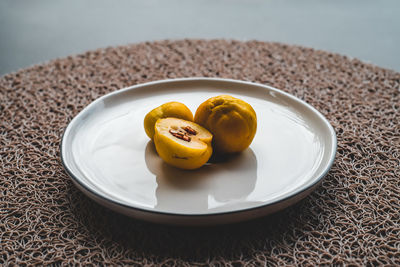 High angle view of fruit in plate on table