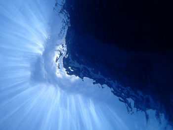 Close-up of snow against blue sky