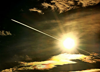 Vapor trail in sky during sunset