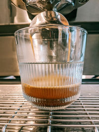 Close-up of coffee in glass on table