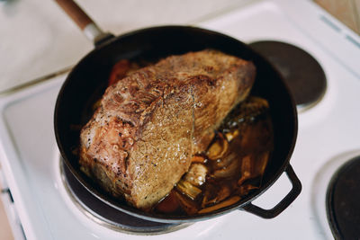 High angle view of meat on barbecue grill