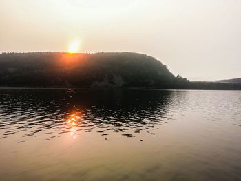 Scenic view of lake at sunset