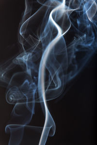 Close-up of smoke against black background