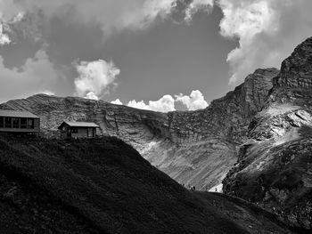 Panoramic view of houses and mountains against sky