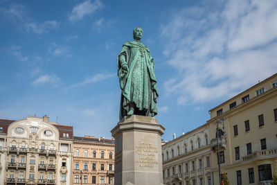 Low angle view of statue against sky