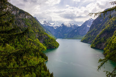 Scenic view of lake and mountains against sky