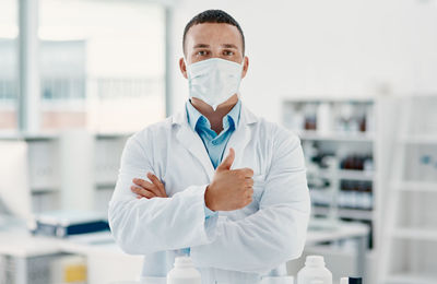 Portrait of female scientist holding dentures