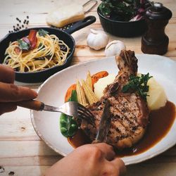 Midsection of person preparing food on table