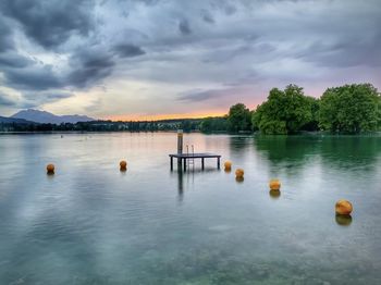 Scenic view of lake against sky during sunset