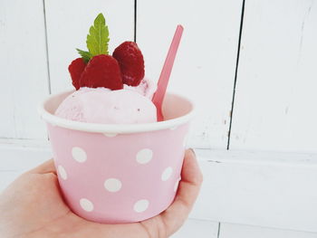 Close-up of cropped hand holding ice cream