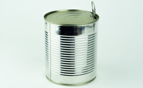 Close-up of glass of jar on white background