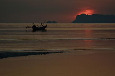 Scenic view of sea against sky at sunset