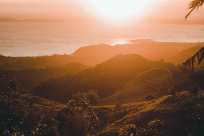 Scenic view of mountains against sky during sunset