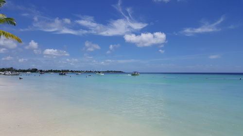 Scenic view of sea against blue sky